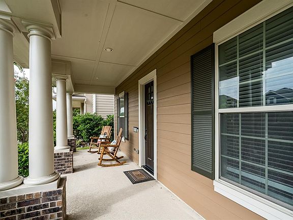 This home offers great curb appeal with its stately columns with brick bases and classic shutters!
