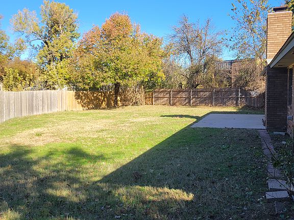 Lovely large back yard with patio and mature shade tree too.