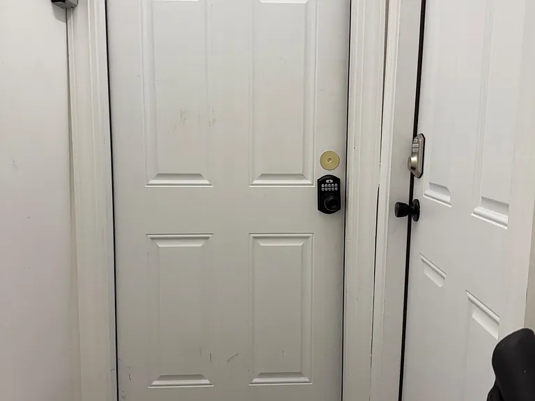 Door to unit at top of stairs.