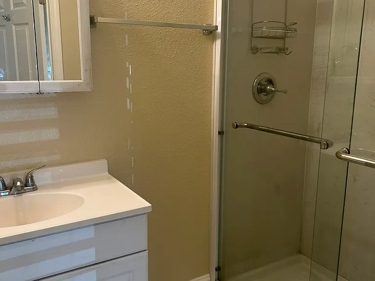 Attached bathroom in downstairs bedroom, freshly painted interiors