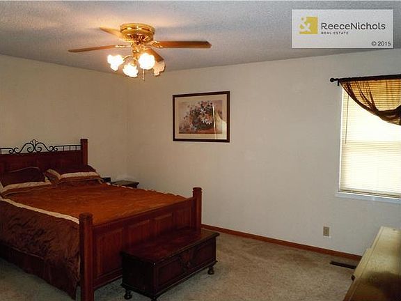 Roomy master bedroom has an en suite half bath