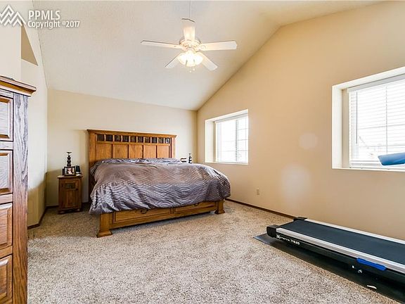 Spacious master bedroom with vaulted ceilings.