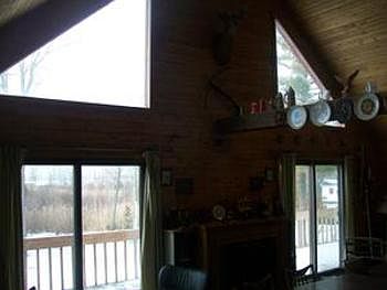 The home features plenty of windows on the water side. Also the patio doors leading to the deckbr