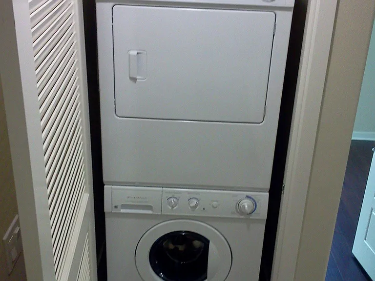 stackable washer/dryer in unit, next to kitchen