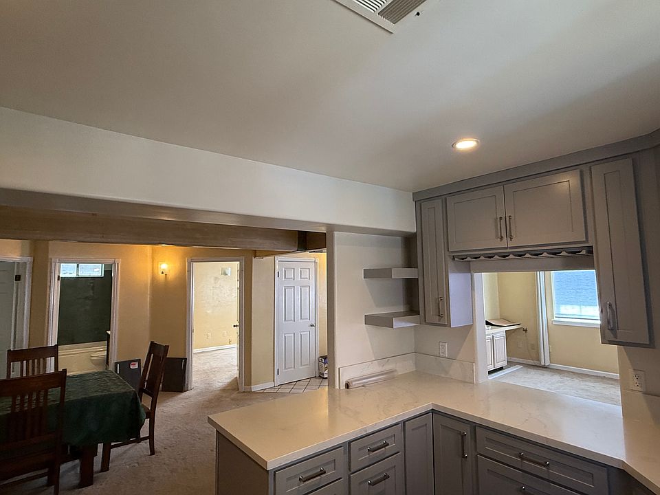 Wide view of kitchen and dining