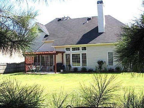 Backyard with patio.