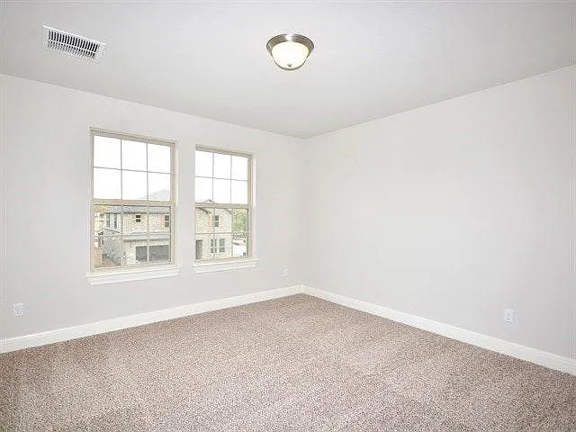 Large bedroom upstairs with lots of natural light and privacy