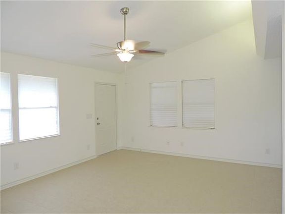 Living Room features Cathedral Ceiling and Cove Lighting.