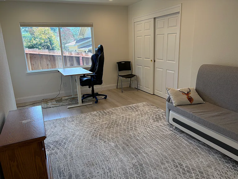 Guest bedroom with ferniture.