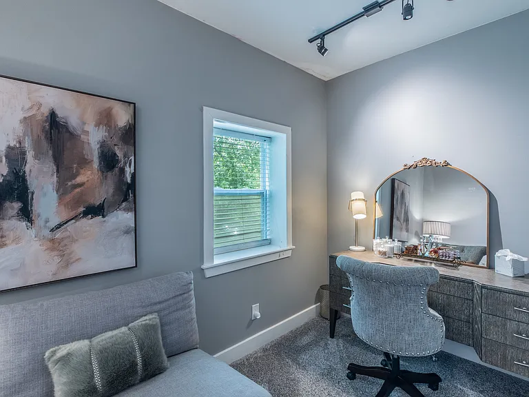 A dedicated vanity or workspace to help you stay organized in the primary bedroom.