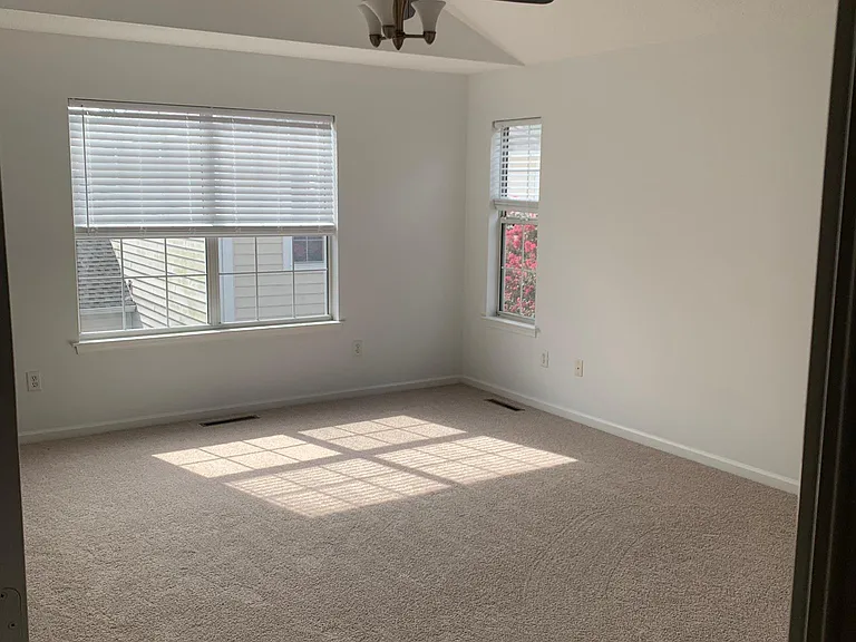 Large Master bedroom with cathedral ceiling, 2 walk in closets and full bath
