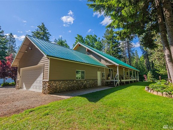 The porch wraps around to the back side of the house!