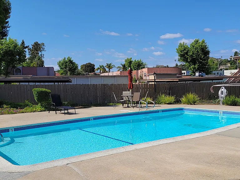 Invitiing pool and sun deck at Plaza Verde Apartments in Escondido, California.