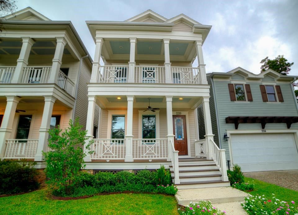 220 is similar exterior and size to 216, but entirely different interior layout. Both have detailed porch trim front & back. Both have complete 1 BR/1Ba quarters above garage. Upper porch on this one attached to master.