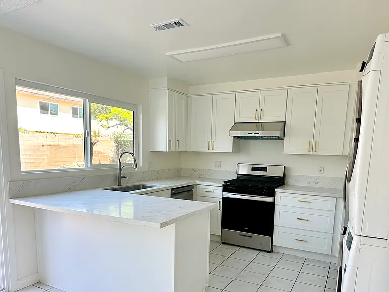 Fully renovated kitchen with new cabinets, new stainless steel appliances