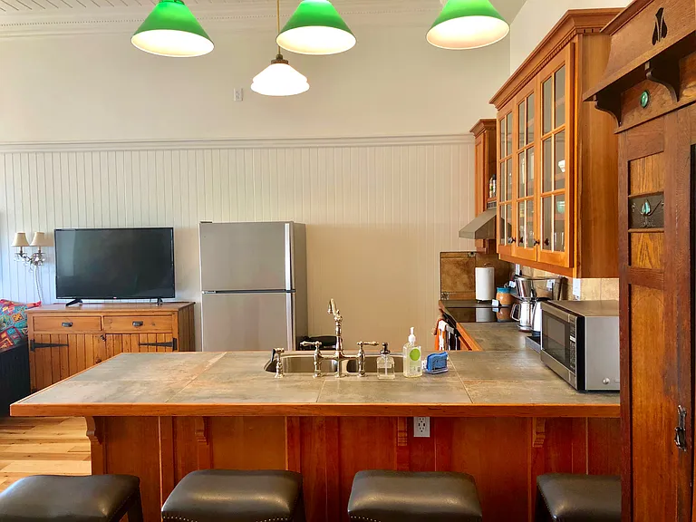 The kitchen counter will be one of your favorite places to eat, work, watch TV or just hang out. Outlet under the counter provides a convenient place to charge your phone or laptop.