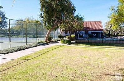 View of the Pool, club house and tennis courts