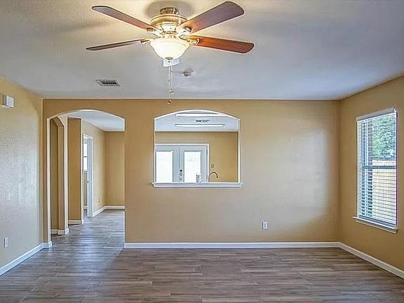 Living Room with new tile and pass through into the kitchen.