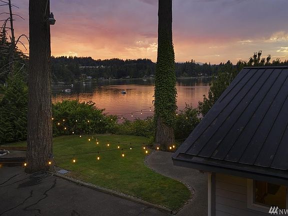 Just to the side of the garage - and the entrance to the kitchen sits this beautiful grassy spot to enjoy the evening sunsets.  Magical! 