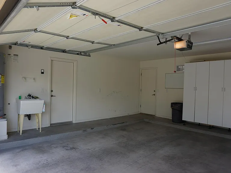Garage: Utility sink; side door leads to the laundry room.