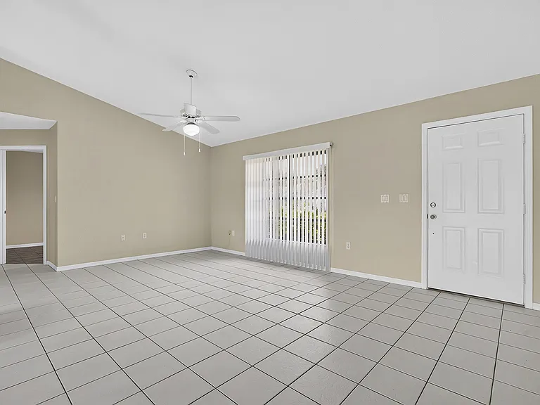 Open floor plan - Living room with large window overlooking the front yard.