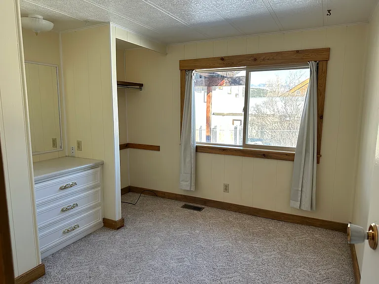Middle bedroom can double as a guest bedroom or office. Great morning light and views of the Cimarrons.