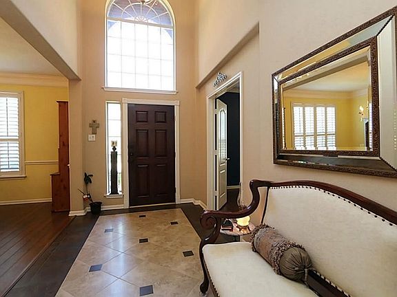 This open bright two story foyer features a huge window and side light providing additional natural 