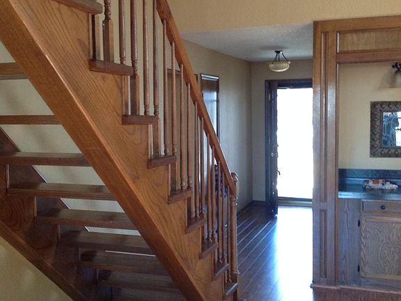 Lovely hardwood flooring, Wet bar in great room, ready for entertaining! Staircase to striking Master Suite with study.