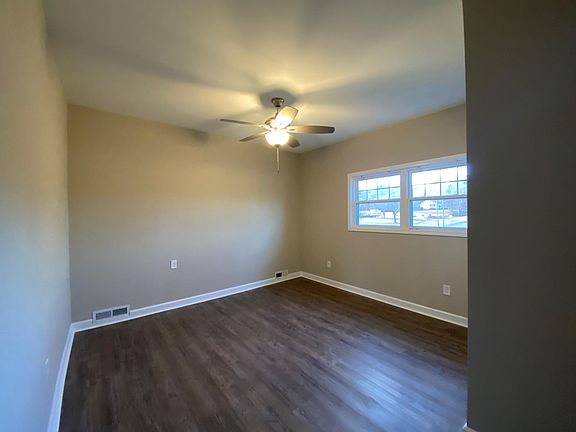 Large primary bedroom with tall ceilings and double closet isolated on the right side of the house.