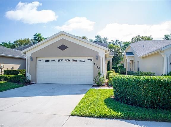 This Hibiscus model villa lives like a single family home and has two car attached garage.