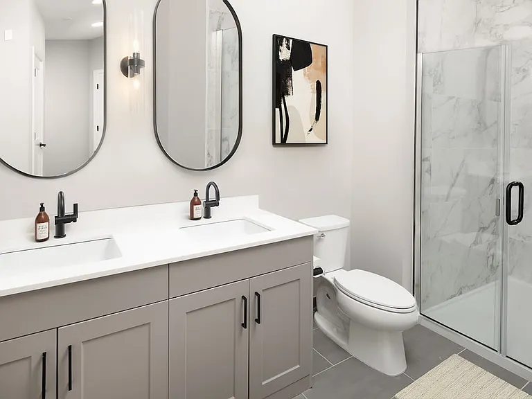 Upgrade Collection bath with quartz countertops and grey cabinetry