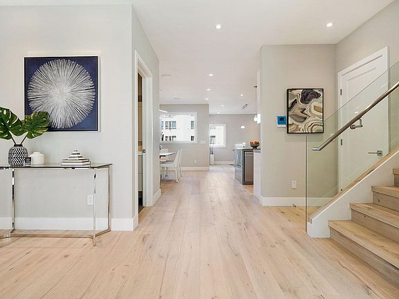 main floor entry lobby with staircase to upper or top floor (furniture & decor not included)