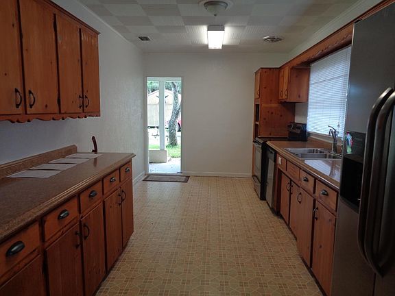 Convenient entry to kitchen from carport.