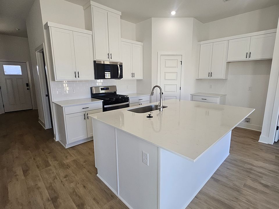 Open kitchen with gas stove, microwave, dishwasher & fridge(coming soon). Farmhouse sink/bar and pantry for all your goods!