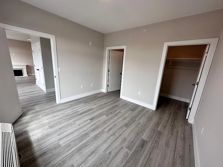 Master bedroom with 2 semi walk-in-closets