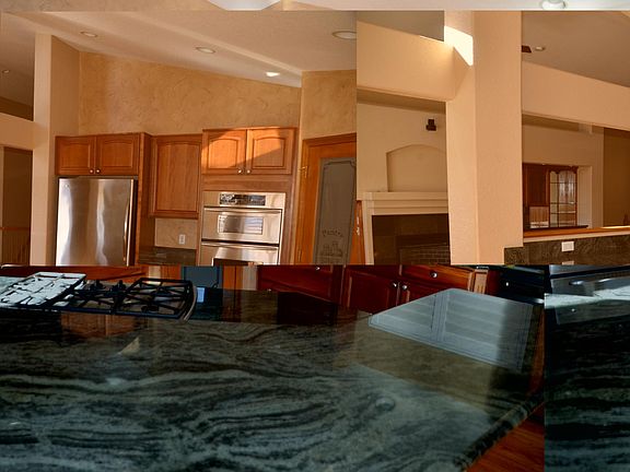 Granite surfaces in large oen kitchen