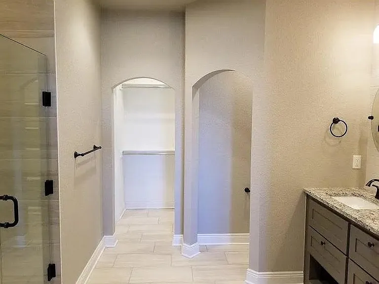 main bath with water closet and entry to main walkin closet