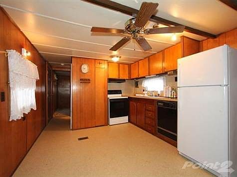 You will enjoy cooking in this spacious country kitchen and there is plenty of cabinet to work with.