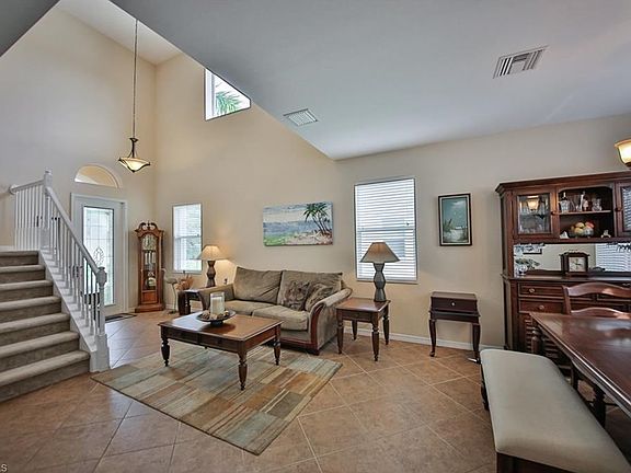 Semi ~ Formal Living and Dining ~ Tile throughout ~ Volume Ceilings ~ Tons of natural light