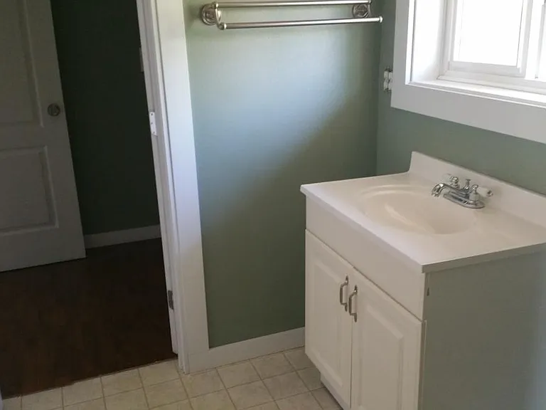Upstairs bathroom has separate powder room and tub/shower room