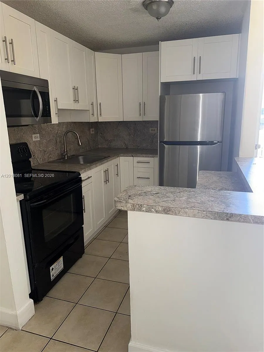 Building Photo - 7120 NW 179th St #105