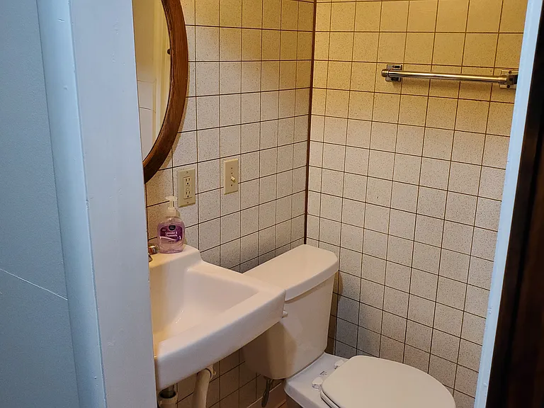 Downstairs 3/4 bathroom (shower opposite sink and toilet.