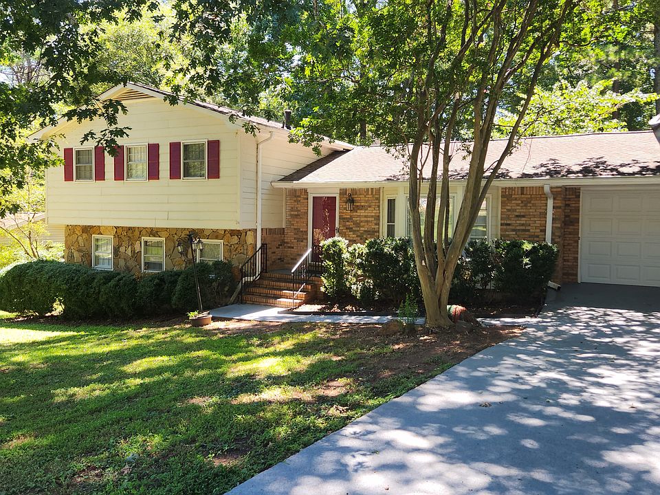 Exterior of home. Plenty of trees to keep home cool in summer.