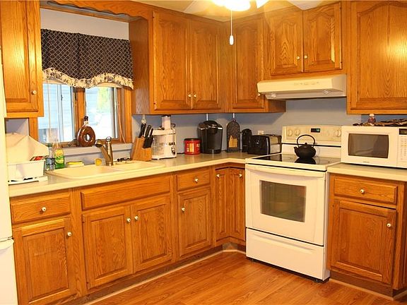 Freshly painted kitchen and new flooring.