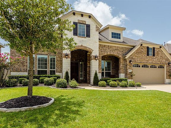 What's not to love about this home's curb appeal? Gorgeous, builder detail, well manicured lawn and a wide driveway for homeowners and guests providing plenty of off-street parking.