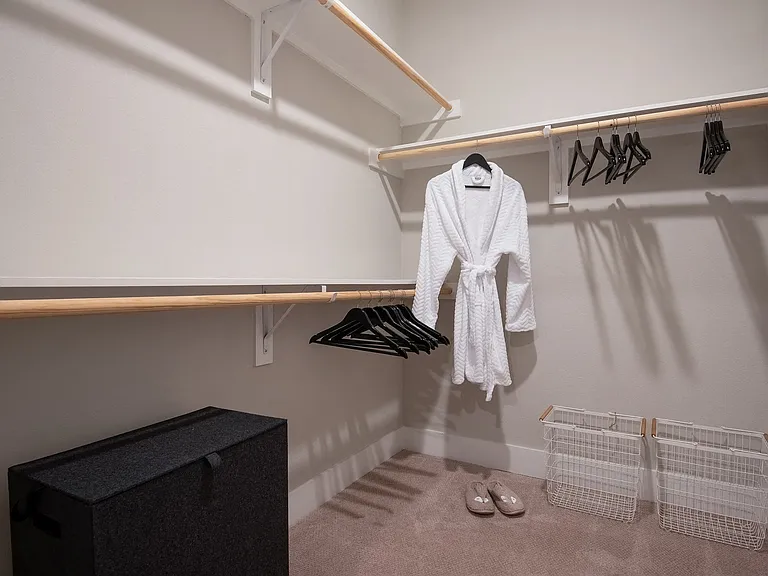 Large walk-in closets with shelving in select bedrooms.
