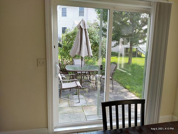 Private patio with outdoor dining set