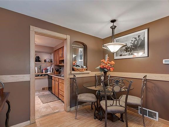 This is the dining rom with part of the kitchen.