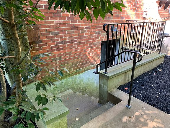 Steps down to apartment entrance
