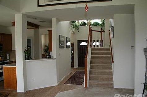 From the living room on. Great picture of the flow of this home. Upstairs allows a little privacy and has a mezzanine looking down on living room. Full open ceiling in Living room with fireplace there to your right. Stone. Gas/Log